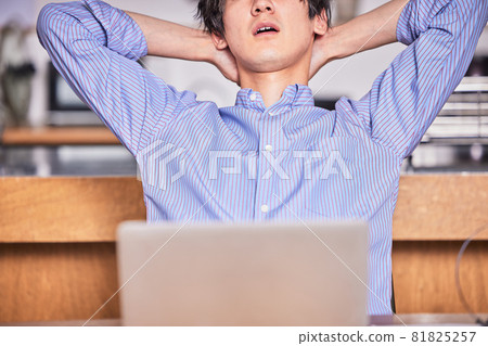 Telework (remote) tired young man Telework (remote) tired young man 81825257