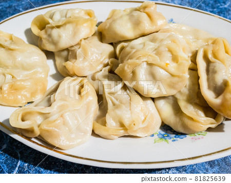 handmade cooked Manti dumpling on plate in rural home kitchen 81825639