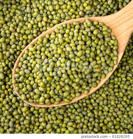 top view of green mung bean in wooden spoon closeup top view of green mung bean in wooden spoon closeup 81826205