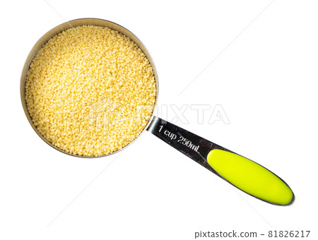 top view of raw North African couscous grains in measuring cup cutout on white background top view of raw North African couscous grains in measuring cup cutout on white background 81826217