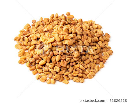 pile of Fenugreek seeds closeup on white background 81826218