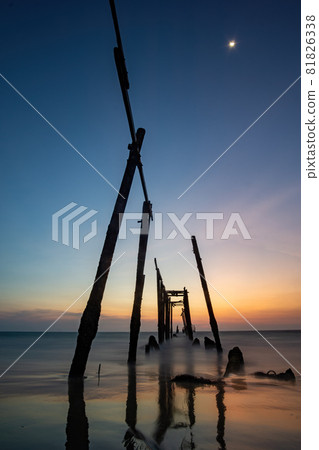 Sunset and reflections from the sea, decaying wooden bridges, Khao Pi Lai Phang Nga beach, Thailand Sunset and reflections from the sea, decaying wooden bridges, Khao Pi Lai Phang Nga beach, Thailand 81826338
