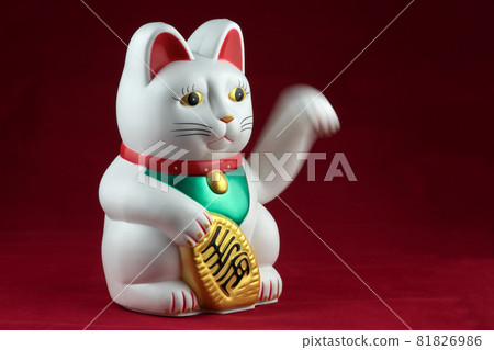 Waving Oriental Good Luck Cat on a Red Background Waving Oriental Good Luck Cat on a Red Background 81826986