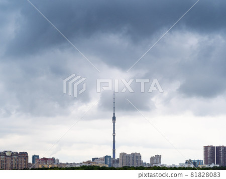 dark rainy clouds over residential district of Moscow city and TV tower in spring 81828083