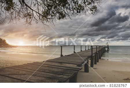 Sea wooden bridge and raining clouds. 81828767