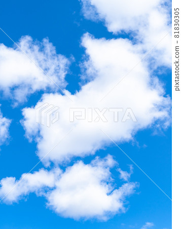 natural vertical background - fluffy white clouds in blue sky on March day natural vertical background - fluffy white clouds in blue sky on March day 81830305