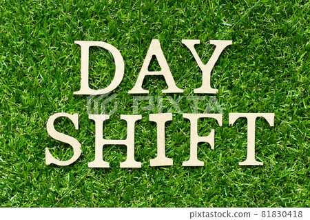 Wood letter in word day shift on green grass background 81830418