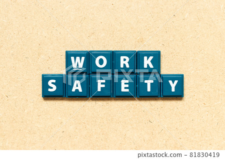 Tile alphabet letter in word work safety on wood background 81830419