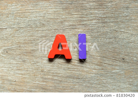 Color alphabet letter in word AI (Abbreviation of artificial intelligence) on wood background 81830420
