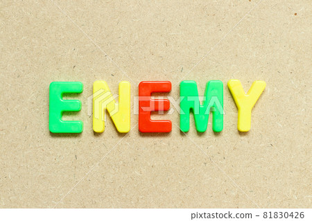 Color alphabet letter with word enemy on wood background 81830426