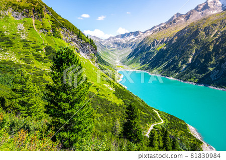 Vivid blue mountain lake in summer Alps. Speicher Zillergrundl dam, Zillertal Alps, Austria 81830984