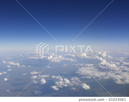 Top view of the earth with clouds. Hot air balloon trip. Extreme tourism in the form of flights on unusual aircraft. Top view of the earth with clouds. Hot air balloon trip. Extreme tourism in the form of flights on unusual aircraft. 81833061