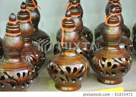 PERAK, MALAYSIA -JULY 9, 2016: Traditional Malay water storage containers or Labu Sayong It is made of clay that has been in the process with a variety of attractive colors and patterns. PERAK, MALAYSIA -JULY 9, 2016: Traditional Malay water storage containers or Labu Sayong It is made of clay that has been in the process with a variety of attractive colors and patterns. 81833472