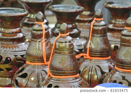 PERAK, MALAYSIA -JULY 9, 2016: Traditional Malay water storage containers or Labu Sayong It is made of clay that has been in the process with a variety of attractive colors and patterns. PERAK, MALAYSIA -JULY 9, 2016: Traditional Malay water storage containers or Labu Sayong It is made of clay that has been in the process with a variety of attractive colors and patterns. 81833475