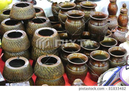 PERAK, MALAYSIA -JULY 9, 2016: Traditional Malay water storage containers or Labu Sayong It is made of clay that has been in the process with a variety of attractive colors and patterns. PERAK, MALAYSIA -JULY 9, 2016: Traditional Malay water storage containers or Labu Sayong It is made of clay that has been in the process with a variety of attractive colors and patterns. 81833482