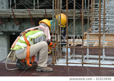 MALACCA, MALAYSIA -MAY 25, 2016: Construction workers fabricating timber form work at the construction site in Malacca, Malaysia. The form work was mainly made from timber and plywood. MALACCA, MALAYSIA -MAY 25, 2016: Construction workers fabricating timber form work at the construction site in Malacca, Malaysia. The form work was mainly made from timber and plywood. 81833698