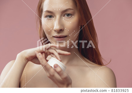 Close-up portrait of young, beautiful and healthy woman with arrows on her face. The spa, surgery, face lifting and skin care concept Close-up portrait of young, beautiful and healthy woman with arrows on her face. The spa, surgery, face lifting and skin care concept 81833925