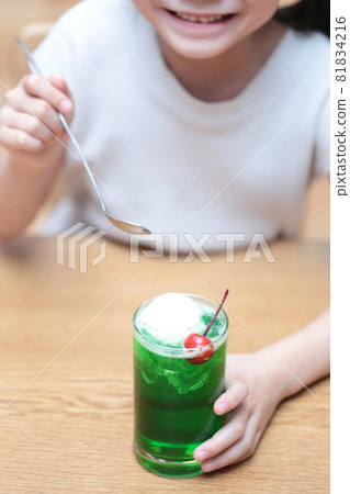 Girl drinking cream soda 81834216