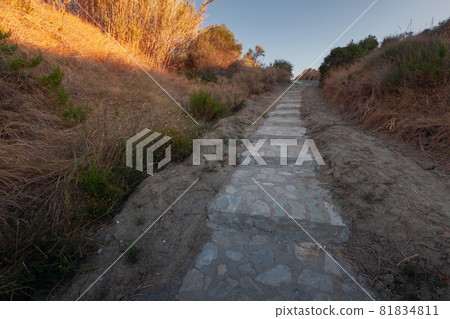 Cobbled walkway perspective, stone stairs going up Cobbled walkway perspective, stone stairs going up 81834811