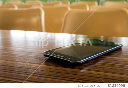 Empty tables and chairs that nobody sit in the seminar room Empty tables and chairs that nobody sit in the seminar room 81834996