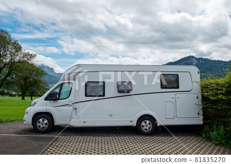 Caravan car vacation. Family vacation travel RV. Holiday trip in motorhome. Switzerland natural landscape Caravan car vacation. Family vacation travel RV. Holiday trip in motorhome. Switzerland natural landscape 81835270