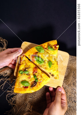 Homemade rustic style pizza with grated Parmesan cheese sauce and basil. Flat lay, top view. Vertical photo Homemade rustic style pizza with grated Parmesan cheese sauce and basil. Flat lay, top view. Vertical photo 81835308