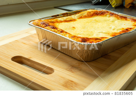 Delicious baked lasagne in an aluminum bowl Delicious baked lasagne in an aluminum bowl 81835605