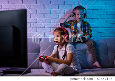 children playing video game with game console 81837177