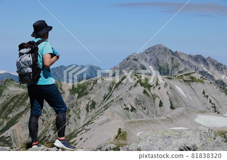 A man aiming for the top of a mountain A man aiming for the top of a mountain 81838320