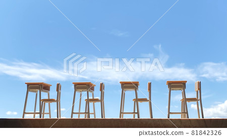 Four school desks lined up in a row and the blue sky Four school desks lined up in a row and the blue sky 81842326