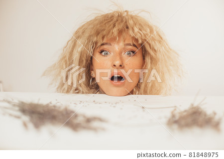Woman looking at camera, while having shock facial emotion Woman looking at camera, while having shock facial emotion 81848975