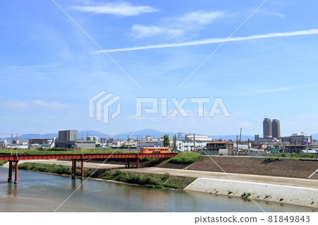 Chinchin train crossing the Yamato River [Osaka] 81849843