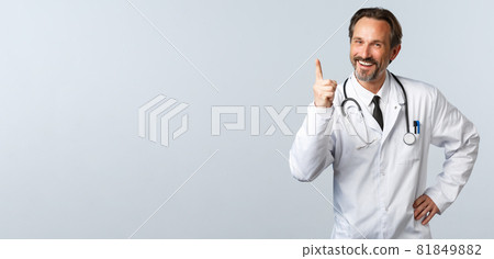 Covid-19, coronavirus outbreak, healthcare workers and pandemic concept. Well played, nice work. Cheerful male doctor in white coat shaking finger and laughing as scolding someone Covid-19, coronavirus outbreak, healthcare workers and pandemic concept. Well played, nice work. Cheerful male doctor in white coat shaking finger and laughing as scolding someone 81849882