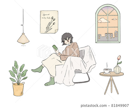 A young woman sitting on a sofa in a calm room in the evening and relaxing while looking at her smartphone 81849907