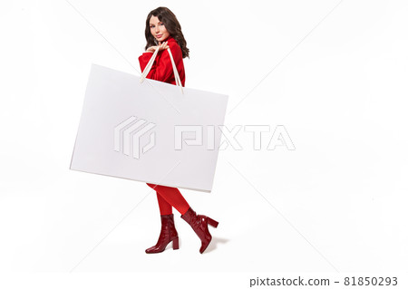 Girl holding big white shopping bag with purchases 81850293