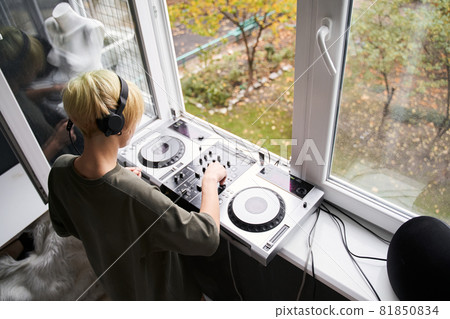 Female music producer with headphones Female music producer with headphones 81850834