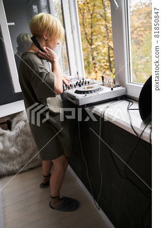 Woman taking off her headset 81850847