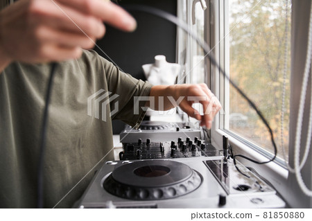 Dj standing near the window and preparing to the work 81850880