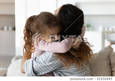 Loving small child girl cuddling affectionate mother. Loving small child girl cuddling affectionate mother. 81850945