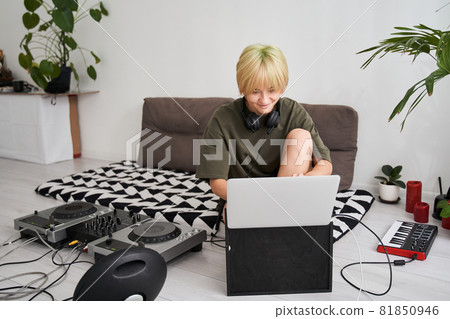 Sound producer working in home recording studio 81850946