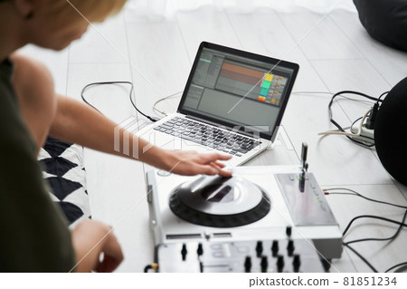 Woman making electronic music on laptop Woman making electronic music on laptop 81851234