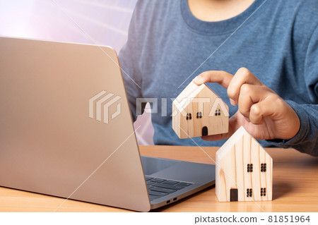 Man using laptop for investment for a house. Concept of Property investment. 81851964