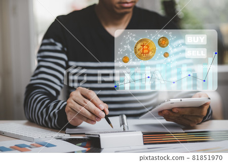 Digital graph with Bitcoin chart on-screen among piles of Bitcoin concept. businessman use calculator, BUY and SELL buttons. Bitcoin on the stock market, Cryptocurrency, and finance. Digital graph with Bitcoin chart on-screen among piles of Bitcoin concept. businessman use calculator, BUY and SELL buttons. Bitcoin on the stock market, Cryptocurrency, and finance. 81851970