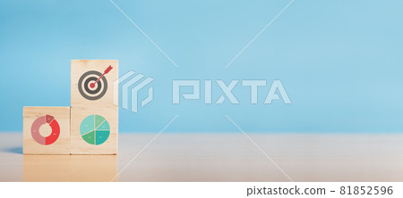 Wood block with icon business strategy and trading graph financial data. Wood block with icon business strategy and trading graph financial data. 81852596