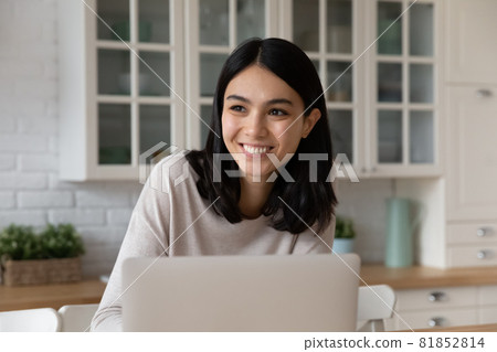 Dreamy happy millennial asian woman creatin new project. 81852814