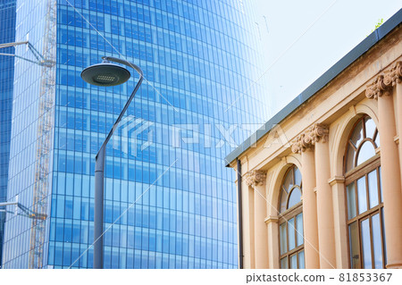 Old building in front of Generali Tower or Hadid Tower in CityLife area, Milan, Italy. Old building in front of Generali Tower or Hadid Tower in CityLife area, Milan, Italy. 81853367