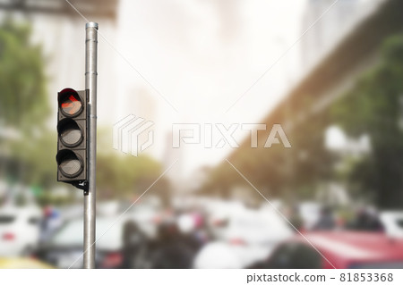 Traffic light with abstract blurred traffic jam background. Traffic light with abstract blurred traffic jam background. 81853368
