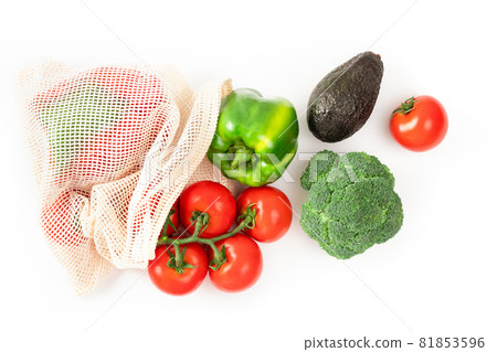 Tomato, pepper, avocado, broccoli in reusable eco friendly bag on white. Sustainable lifestyle. Plastic free food shopping. Zero waste concept. 81853596