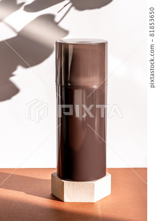 Brown cosmetic shower gel bottle on wooden geometric pedestal podium, product packaging with natural shadows from plants, antiperspirant for men, shaving foam, shampoo mockup Brown cosmetic shower gel bottle on wooden geometric pedestal podium, product packaging with natural shadows from plants, antiperspirant for men, shaving foam, shampoo mockup 81853650