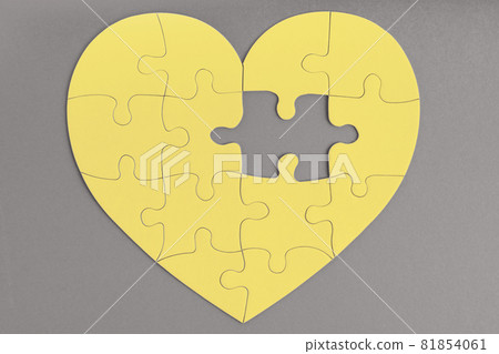 Trendy color of the year 2021. Ultimate grey and illuminating yellow. Missing piece of jigsaw puzzle in heart shape. Love, charity, donation concept Trendy color of the year 2021. Ultimate grey and illuminating yellow. Missing piece of jigsaw puzzle in heart shape. Love, charity, donation concept 81854061